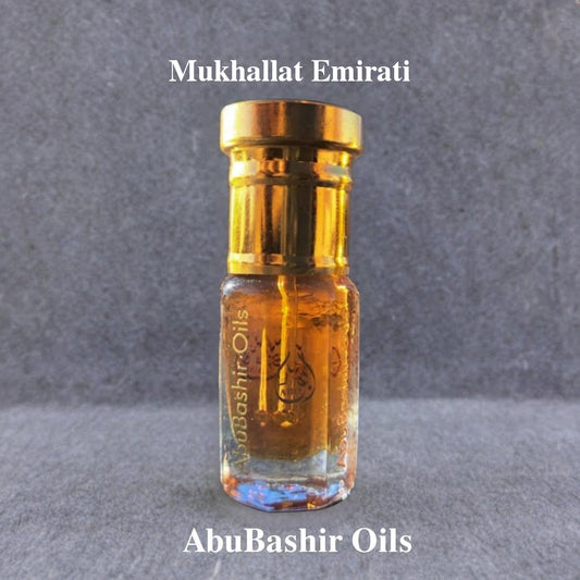 Mukhallat Emirati perfume oil by AbuBashir Oils in a small glass bottle with gold cap showcasing traditional Arabian fragrance blend