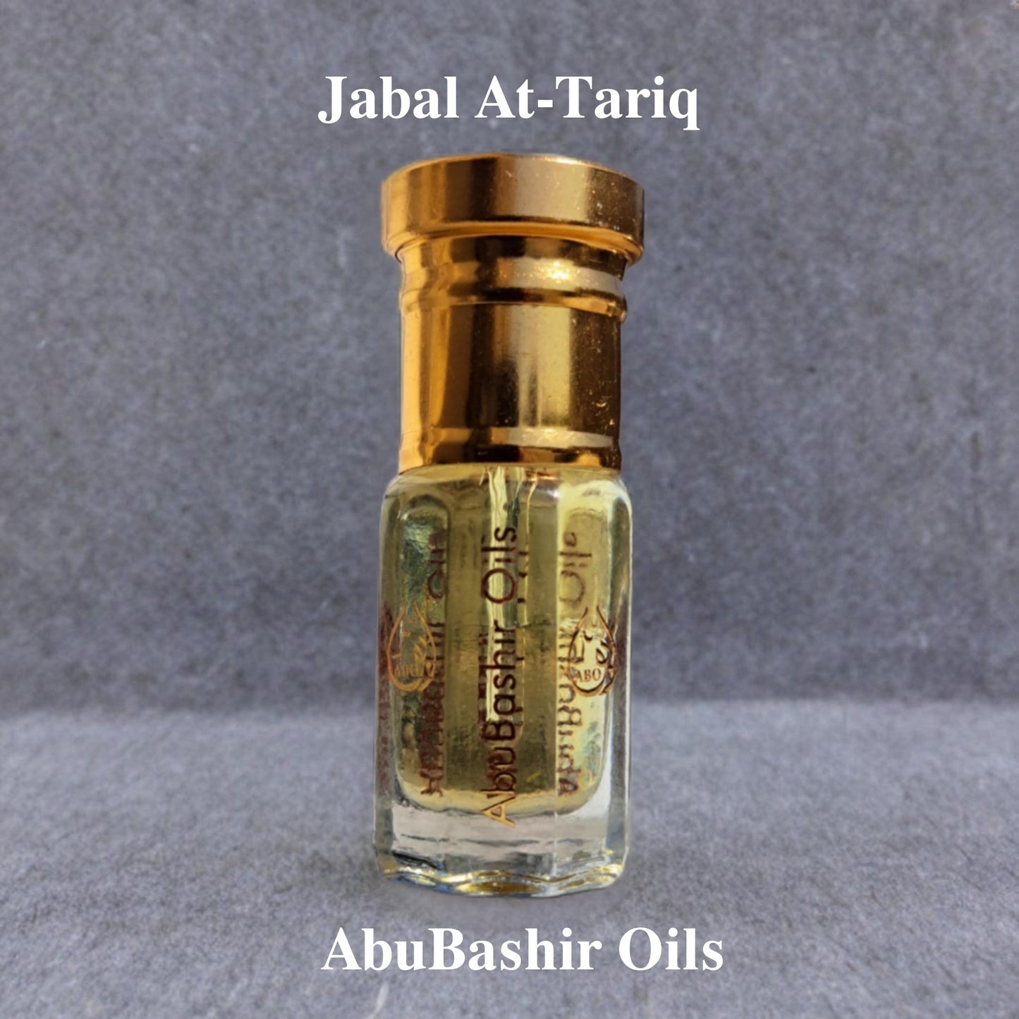 Jabal At-Tariq alcohol-free fragrance oil with citrus, amber, spice, musk, and woodsy notes by AbuBashir Oils