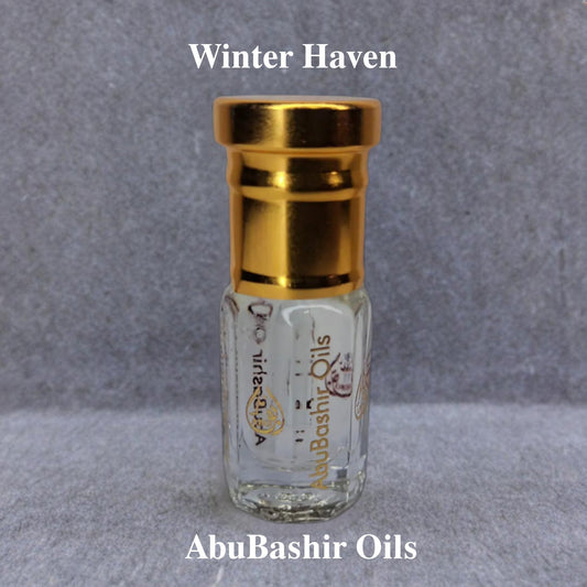 Winter Haven fragrance oil bottle by AbuBashir Oils with golden cap on grey background